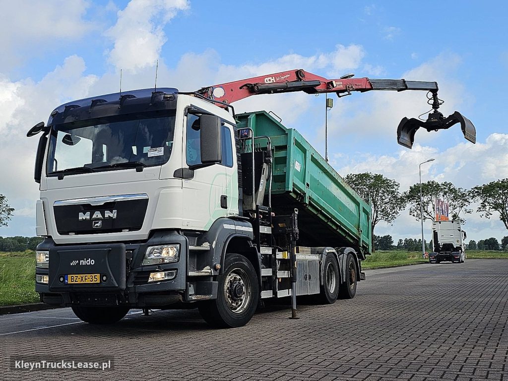 MAN 26.400 TGS 6X4H-4 EEV HMF CRANE z 2012 roku, hakowiec z zagranicy — przód pojazdu